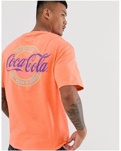 Bershka Coca-Cola - T-shirt imprimé dans le dos - Orange