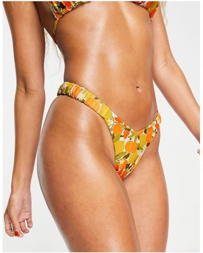Kulani Kinis X hannah meloche - slip bikini rétro sgambato con stampa mista di limoni e arance - Arancione