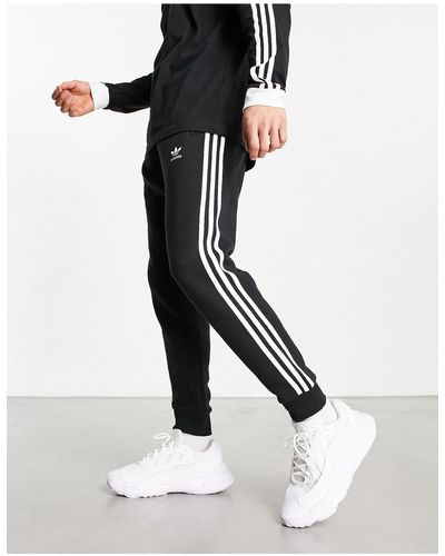 adidas Originals – e jogginghose mit drei streifendesign - Schwarz