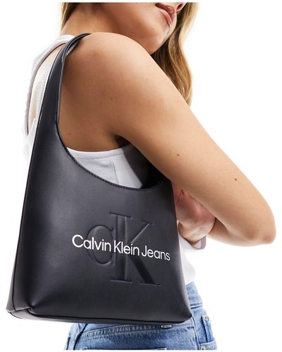 Calvin Klein – geformte, abgerundete schultertasche - Mehrfarbig