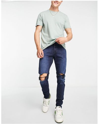 Jack & Jones Intelligence - pete - jeans carrot skinny lavaggio nero con strappi sulle ginocchia - Blu
