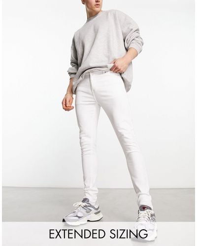 ASOS – e sprayon-jeans mit powerstretch - Weiß