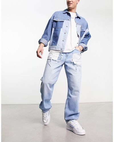ASOS Jeans larghi lavaggio chiaro con strappi vistosi - Blu