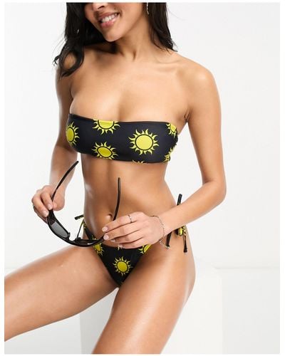 Noisy May Top bikini a fascia nero con soli stampati e allacciatura sul retro