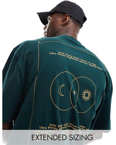 ASOS T-shirt oversize scuro con stampa celestiale sul retro - Verde