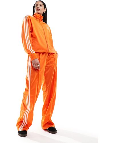 adidas Originals Firebird - pantaloni della tuta ampi arancioni - Arancione