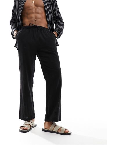 South Beach Pantalones playeros con acabado texturizado - Negro