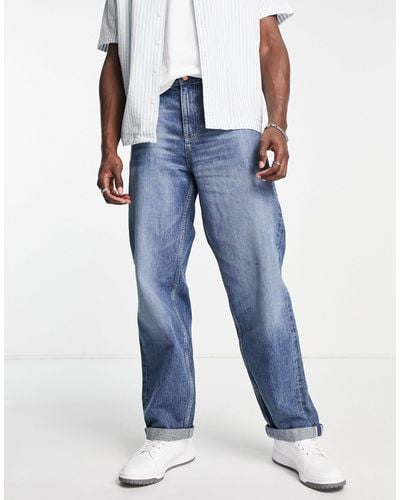 ASOS Jeans extra larghi con cimosa lavaggio medio - Blu