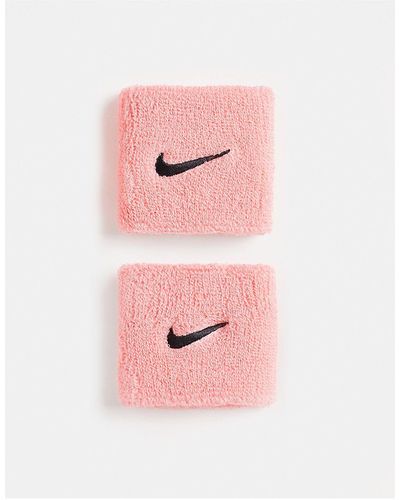 Nike Muñequeras s unisex con logo - Rosa