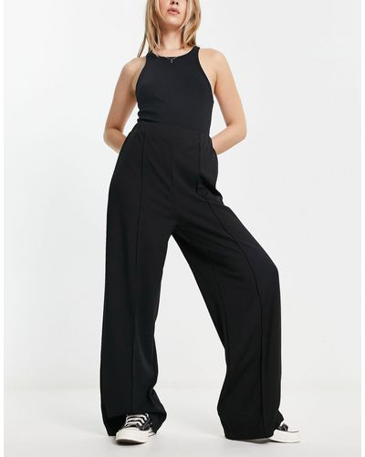 ASOS Pantalon ample et fluide en jersey - Noir