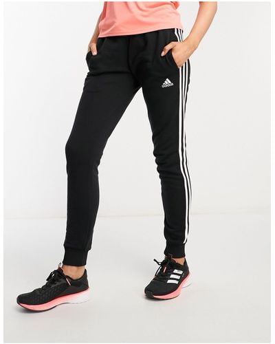adidas Originals Adidas - sportswear essentials - joggers neri e bianchi con 3 strisce - Nero