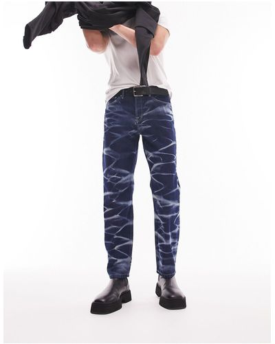 TOPMAN – legere jeans mit dunkler, gebleichter waschung mit wellenmuster - Blau