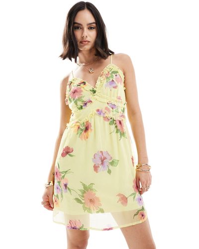 Vero Moda Vestito corto con spalline sottili limone a fiori con volant - Bianco