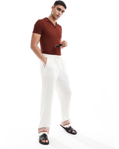 ASOS Pantalones s holgados con bordados en los bajos - Blanco