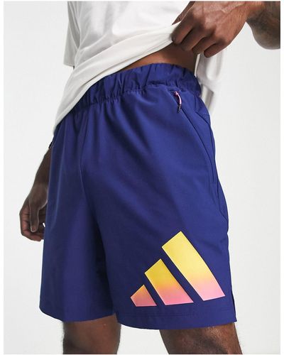 adidas Originals Adidas - training train icons - pantaloncini da 7" con 3 strisce iconiche sfumate - Blu