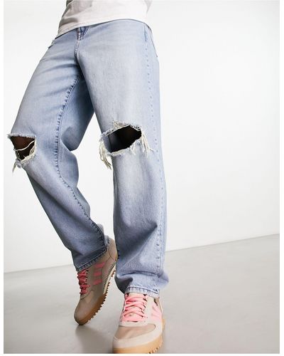 ASOS Ruimvallende Jeans Met Kniescheuren - Blauw