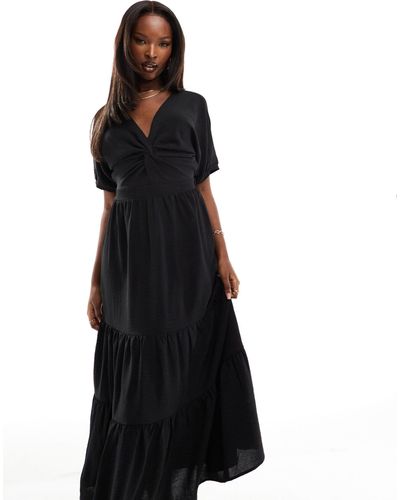 AX Paris Vestido semilargo con mangas abullonadas, bajo escalonado y lazada en la parte trasera - Negro