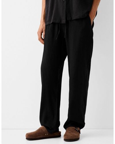 Bershka Pantalon large en lin - Noir