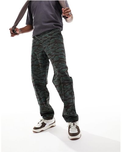 ASOS Pantalon chino baggy à imprimé camouflage - Noir