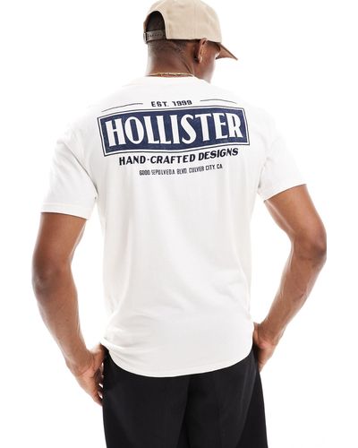 Hollister Camiseta color crema con estampado en la espalda - Blanco