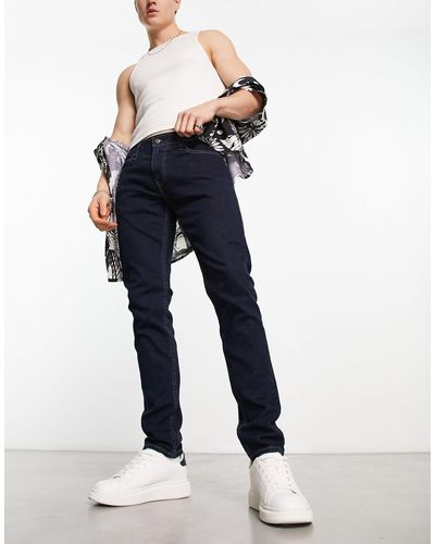 Hollister Skinny-fit Jeans Met Spoeling En Donkere Wassing - Blauw
