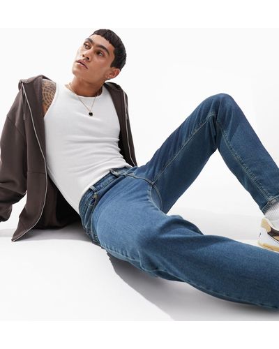 ASOS Jeans stretch affusolati lavaggio scuro - Blu