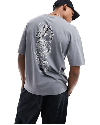 Jack & Jones T-shirt oversize grigia slavata con stampa di dragone sul retro - Blu