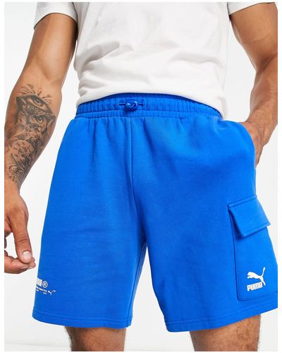 PUMA Pantalones cortos es cargo con lavado ácido luminoso exclusivos en asos - Azul