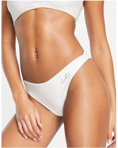 The Couture Club Slip bikini bianchi con logo sul davanti - Nero