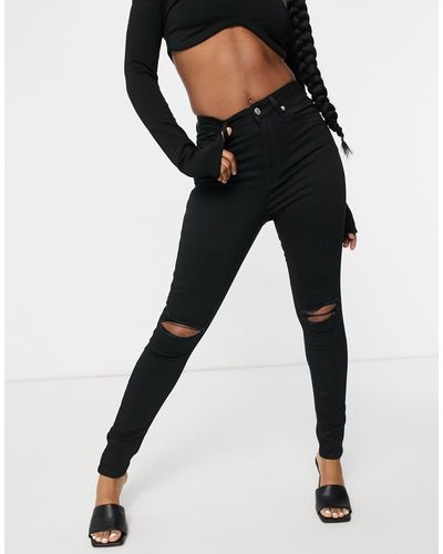 NA-KD Katoenen Gescheurde Skinny Jeans Met Hoge Taille - Zwart