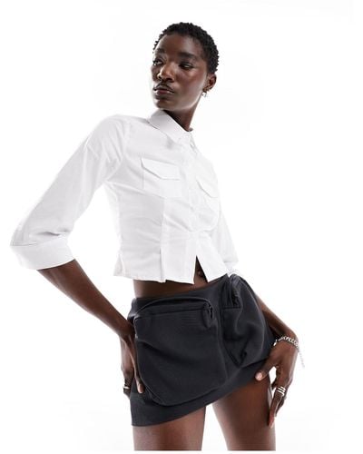 The Kript Micro Mini Cargo Skirt With Oversized Pockets - White