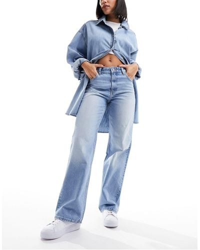 Bershka Jeans a fondo ampio e vita alta anni '90 lavaggio chiaro - Blu