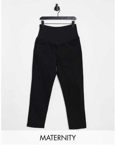 Cotton On Maternity - mom jeans elasticizzati neri con fascia sopra al pancione - Blu