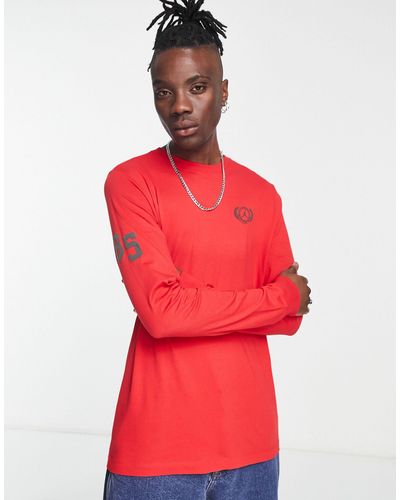 Nike T-shirt à manches longues avec logo imprimé au dos - flamboyant - Rouge