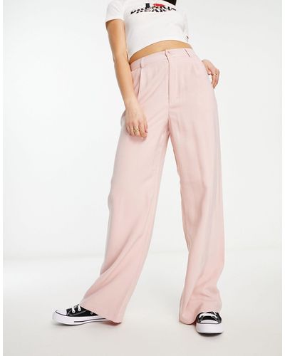 Stradivarius Pantaloni sartoriali a fondo ampio - Rosa