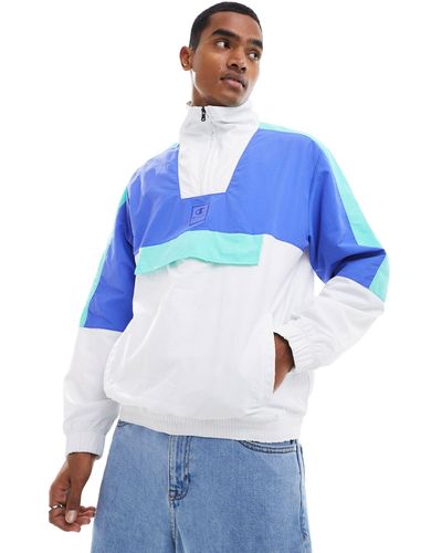 Champion Sudadera blanca y azul con diseño color block y media cremallera