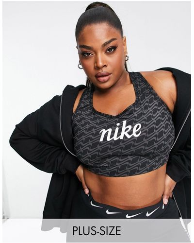 Nike Plus - icon clash swoosh aop - reggiseno sportivo a supporto medio con stampa e logo - Nero