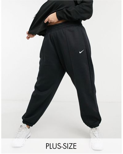 Nike Plus - Oversized joggingbroek Met Mini Swoosh - Zwart