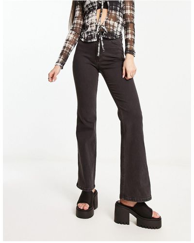 Weekday – glow – stretch-jeans mit hoher taille und schlag - Schwarz