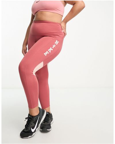 Nike Plus - swoosh run fast dri-fit - leggings alla caviglia a vita medio alta con logo stile college - Rosso