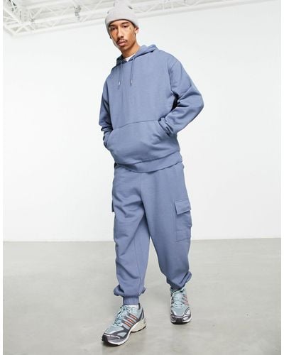 ASOS – oversize-trainingsanzug mit kapuzenpullover und oversize-jogginghose mit cargotasche - Blau