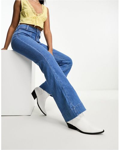 Wrangler Jeans a zampa con tasche sul davanti - Blu