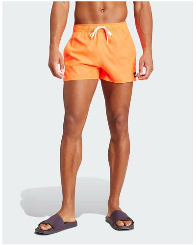 adidas Originals Adidas - clx - pantaloncini da bagno molto corti rossi con 3 strisce - Arancione