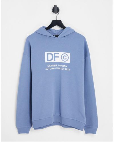 ASOS Asos dark future - sweat à capuche oversize avec logos imprimés sur le devant et la capuche - foncé - Bleu