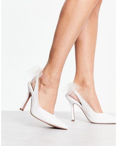 ASOS Petal - scarpe con tacco alto avorio glitterato con fiocco sul cinturino posteriore - Bianco