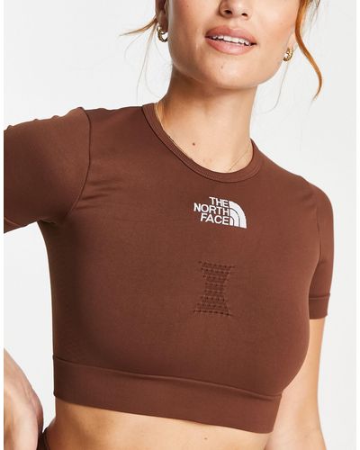 The North Face Camiseta corta deportiva sin costuras exclusiva en asos - Marrón
