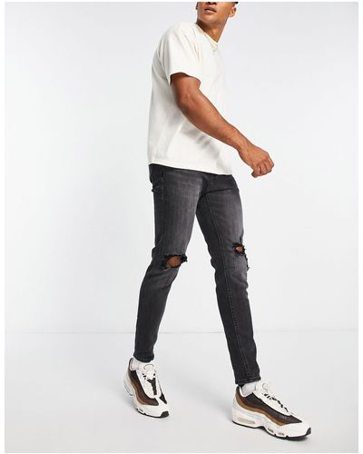 Jack & Jones Intelligence - pete - jeans carrot skinny slavato con strappi sulle ginocchia - Bianco
