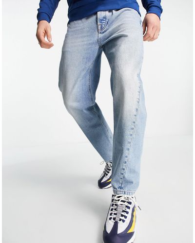 TOPMAN Jeans affusolati con fondo curvo lavaggio azzurro - Blu