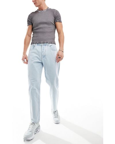 Armani Exchange – weite, schmal zulaufende jeans mit heller waschung - Blau