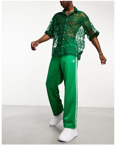 Adidas originals online trainingsbroek groen